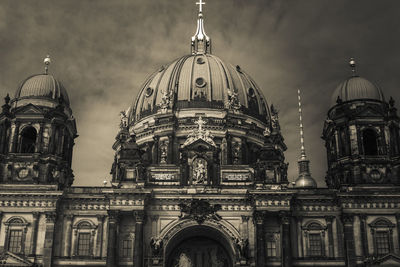 Low angle view of cathedral against cloudy sky