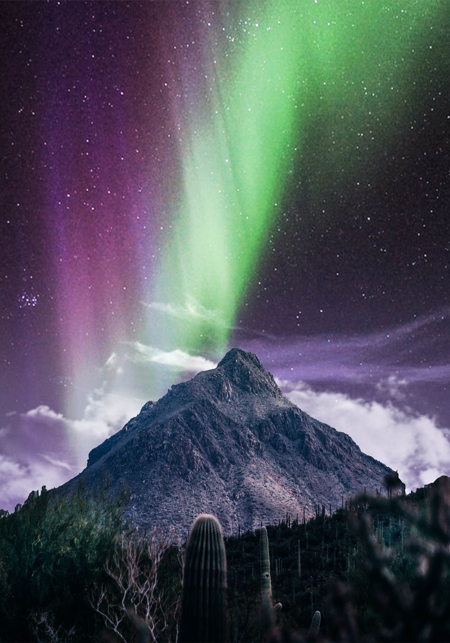 Low angle view of mountain against sky at night