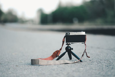 Close-up of camera on road