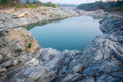 Scenic view of lake and rock formation