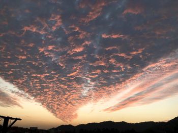 Low angle view of dramatic sky during sunset