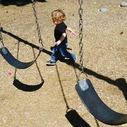 Full length of boy shadow on floor