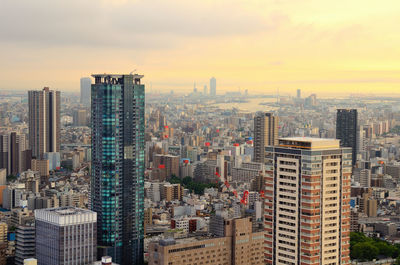 Cityscape against sky during sunset