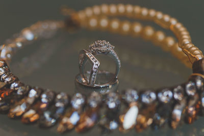 Close-up of jewelries on glass table