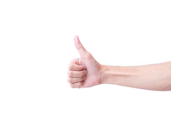 Close-up of woman hand over white background