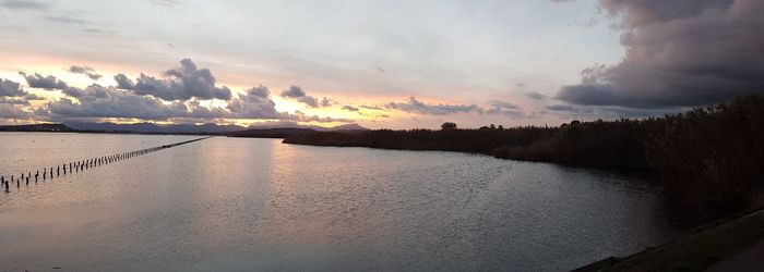 Panoramic view of sea against sky during sunset