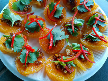 High angle view of fruits in plate on table