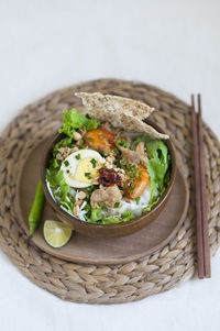 Vietnamese noodle - my quang, vietnamese traditional cuisine, noodles in bowl on the table 