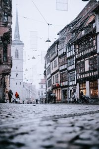 Surface level of street amidst buildings in city