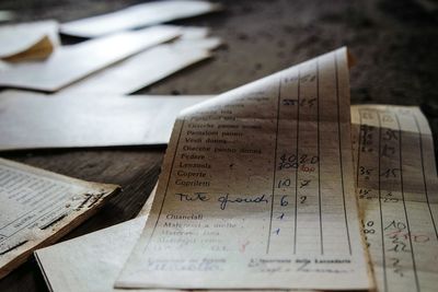Close-up of old papers on wooden table