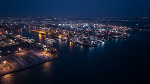 High angle view of illuminated buildings in city at night