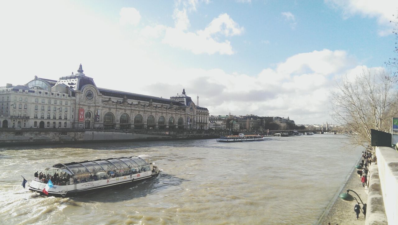 architecture, built structure, building exterior, water, nautical vessel, sky, transportation, boat, waterfront, mode of transport, cloud - sky, moored, day, travel, outdoors, incidental people, sea, travel destinations, cloud, river