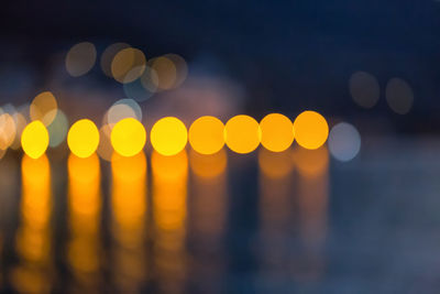 Defocused image of illuminated lights at night