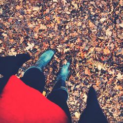 Low section of person standing on tiled floor