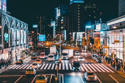 Vehicles on city street at night