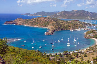 High angle view of st john's harbor boats on sea shore against sky