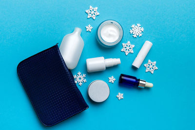 High angle view of beauty products on blue background