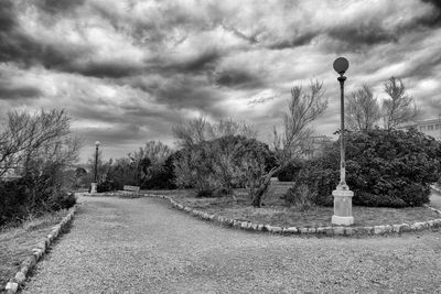 Street light by road against sky