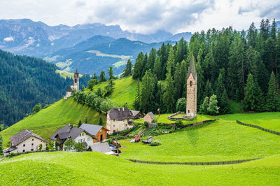 Panoramic shot of trees and houses against sky