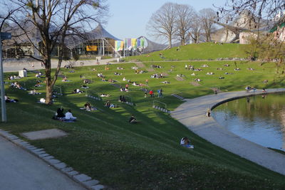 Scenic view of park in city against sky