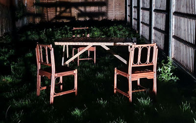 Abandoned chair against building