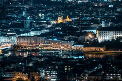 High angle view of illuminated buildings at night