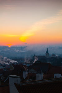 High angle view of buildings against sky during sunset