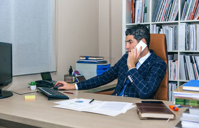 Man working on book