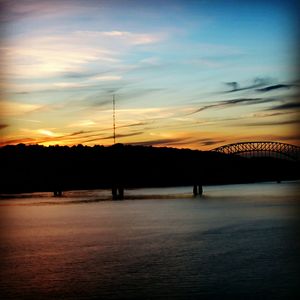 Scenic view of river at sunset