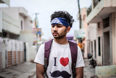 Portrait of young man standing outdoors