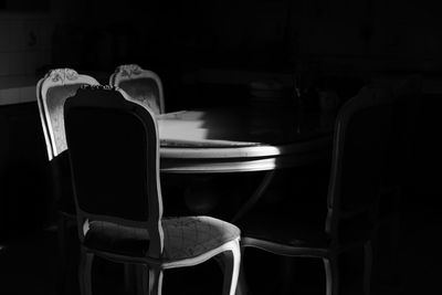 Empty chairs and tables in the darkroom