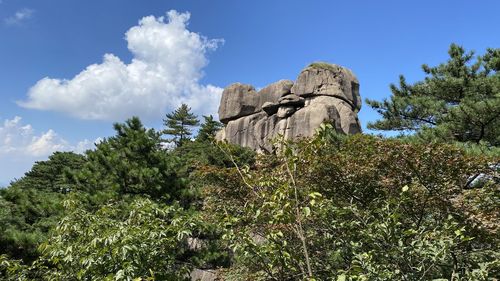 Low angle view of rocks against sky