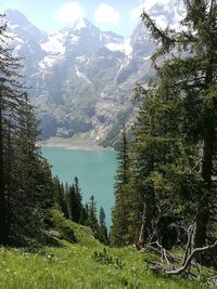 Scenic view of lake and mountains against sky