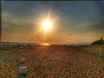 Scenic view of beach at sunset