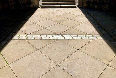 High angle view of tiled floor by building