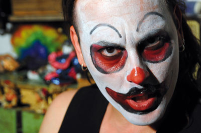 Close-up portrait of man with painted face