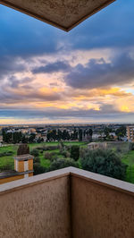 High angle view of buildings against sky during sunset