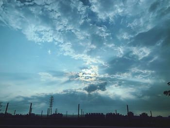 Silhouette buildings against sky