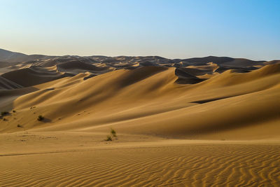 Scenic view of desert against clear sky