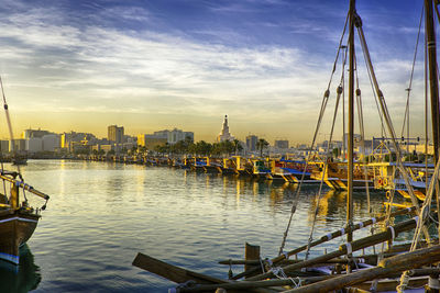 Boats moored at harbor - doha corniche 