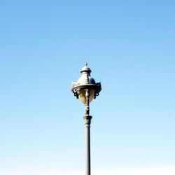 Low angle view of street light against clear blue sky