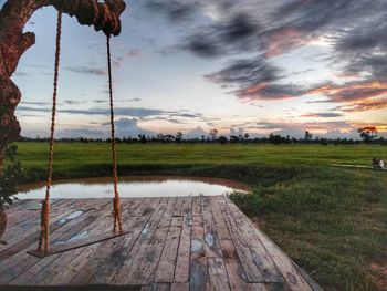 Scenic view of lake against sky during sunset