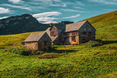 House on field against sky