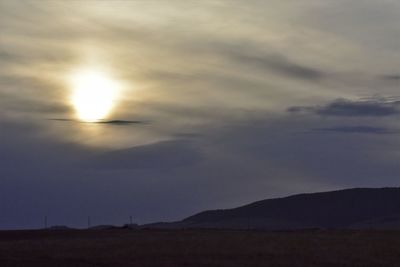 Low angle view of silhouette land against sky during sunset