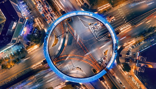 High angle view of light trails on road in city