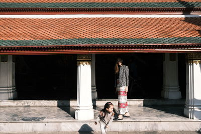 Full length of man outside temple against building