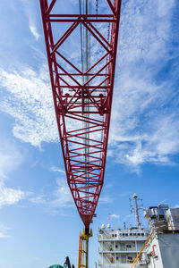 Crane in the sky on board a construction work barge at offshore oil field