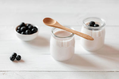 Two portions of blueberry yoghurt, side view