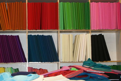 Colorful curtains in shop for sale