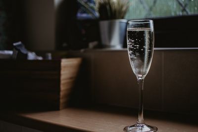 Close-up of wine in glass on table